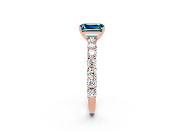 Rose gold Emerald Cut Blue Topaz Solitaire Ring with Shared Prong Pavé Band and Four-Prong Setting