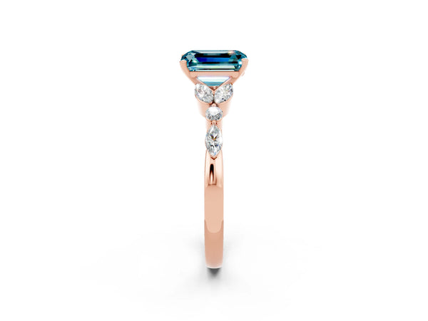 Rose gold Emerald Cut Blue Topaz Solitaire Ring with Side Stones and Four-Prong Setting