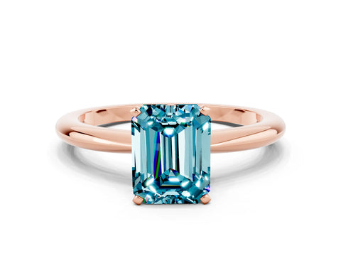 Rose gold Emerald Cut Blue Topaz Solitaire Ring with Six-Prong Setting and Classic Band