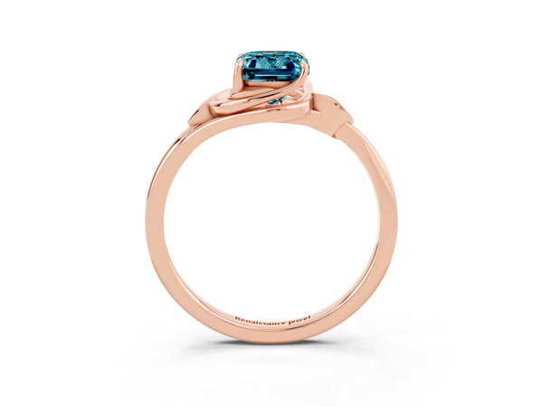 Rose gold Emerald Cut Blue Topaz Solitaire Ring with Twist Band and Four-Prong Setting