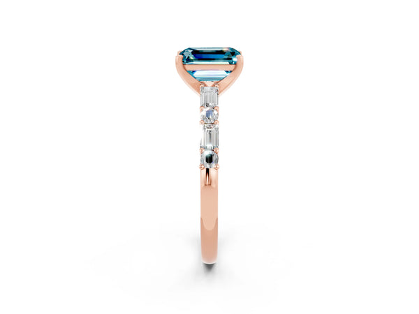Rose gold Emerald Cut Blue Topaz Solitaire with Side Baguettes and Channel Set Band