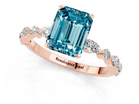 Rose gold Emerald Cut Blue Topaz Solitaire with Side Stones on a Pavé Band and Four-Prong Setting_1