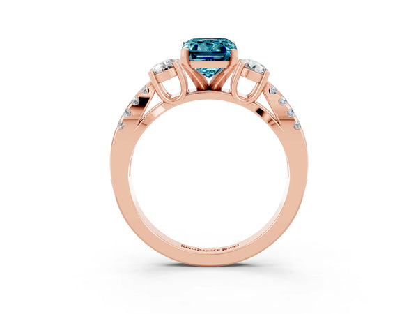 Rose gold Emerald Cut Blue Topaz Three-Stone Ring with Pavé Split Shank and Four-Prong Setting