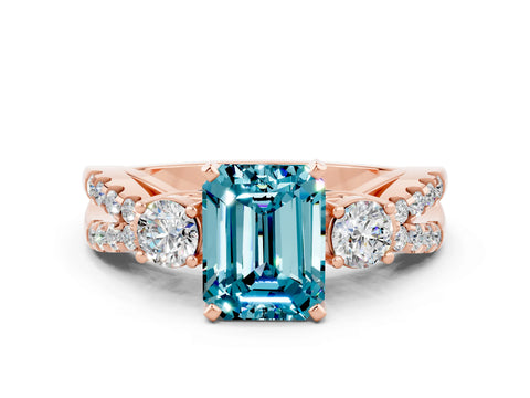 Rose gold Emerald Cut Blue Topaz Three-Stone Ring with Pavé Split Shank and Four-Prong Setting