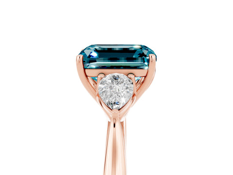 Rose gold Emerald Cut Blue Topaz Three-Stone Ring with Pear Side Stones and Four-Prong Setting_17