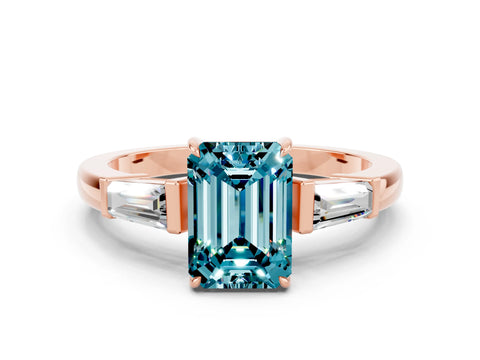 Rose gold Emerald Cut Cut Diamond Ring with Tapered Baguette Side Stones in Four-Prong Setting