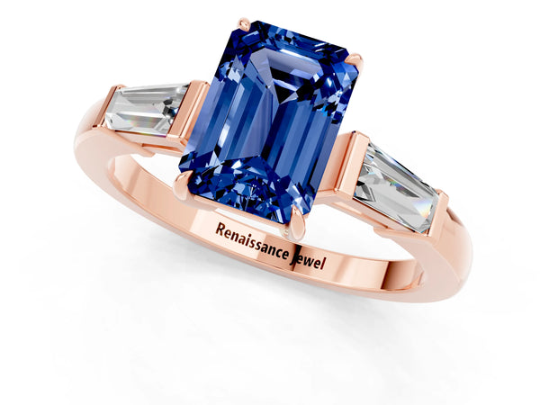 Rose gold Emerald Cut Blue Sapphire Three-Stone Ring with Tapered Baguette Side Stones and Prong Setting