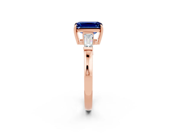 Rose gold Emerald Cut Blue Sapphire Three-Stone Ring with Tapered Baguette Side Stones and Prong Setting