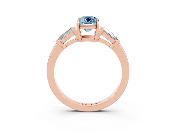 Rose gold Emerald Cut Aquamarine Three-Stone Ring with Tapered Baguette Side Stones and Prong Setting