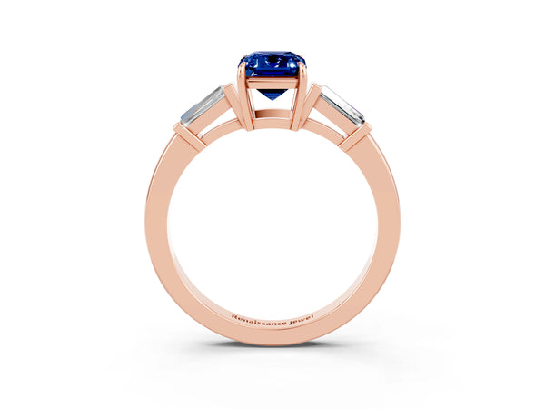 Rose gold Emerald Cut Blue Sapphire Three-Stone Ring with Tapered Baguette Side Stones and Prong Setting