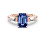 Rose gold Emerald Cut Cut Diamond Ring with Tapered Baguette Side Stones in Four-Prong Setting