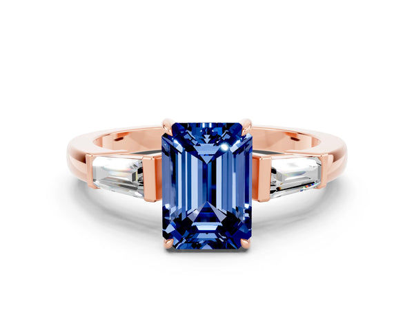 Rose gold Emerald Cut Blue Sapphire Three-Stone Ring with Tapered Baguette Side Stones and Prong Setting