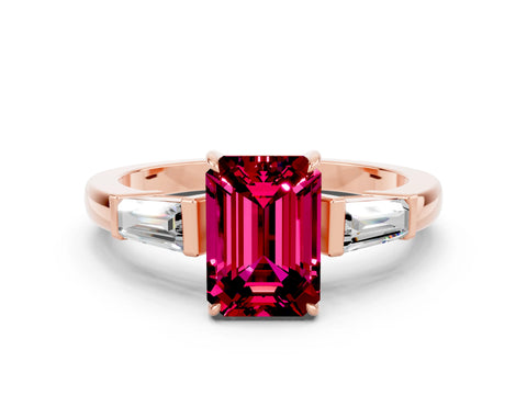Rose gold Emerald Cut Cut Diamond Ring with Tapered Baguette Side Stones in Four-Prong Setting
