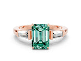 Rose gold Emerald Cut Cut Diamond Ring with Tapered Baguette Side Stones in Four-Prong Setting