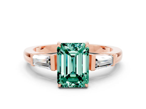 Rose gold Emerald Cut Cut Diamond Ring with Tapered Baguette Side Stones in Four-Prong Setting