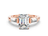 Rose gold Emerald Cut Cut Diamond Ring with Tapered Baguette Side Stones in Four-Prong Setting