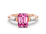 Rose gold Emerald Cut Cut Diamond Ring with Tapered Baguette Side Stones in Four-Prong Setting