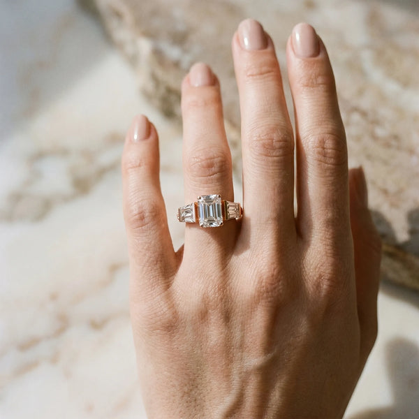 Rose gold Emerald Cut Diamond Engagement Ring with Baguette Side Stones and Channel Set Band