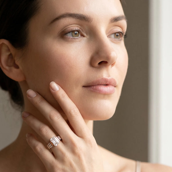 Rose gold Emerald Cut Diamond Engagement Ring with Baguette Side Stones and Channel Set Band