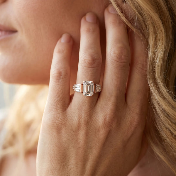 Rose gold Emerald Cut Diamond Engagement Ring with Baguette Side Stones and Channel Set Band