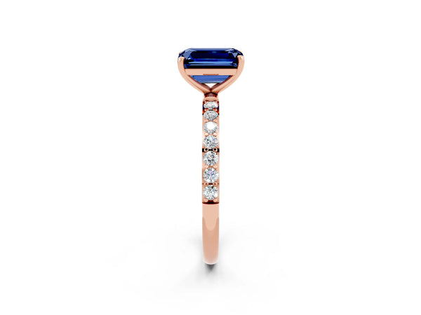 Rose gold Emerald Cut Blue Sapphire Solitaire Ring with Round Pavé Shoulders and Prong Setting