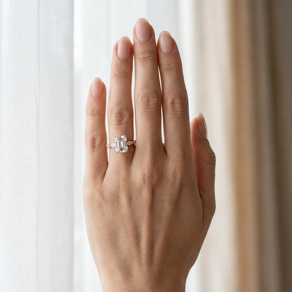 Rose gold Emerald Cut Diamond Ring with Marquise Side Stones and Prong Setting