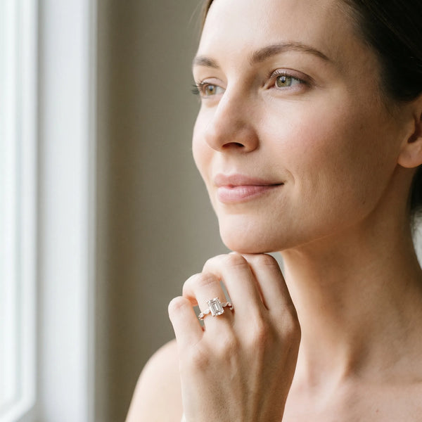 Rose gold Emerald Cut Diamond Ring with Marquise Side Stones and Prong Setting