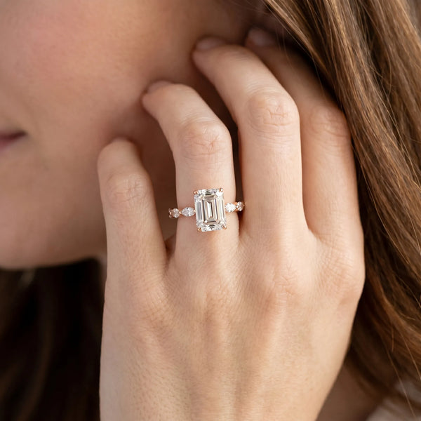 Rose gold Emerald Cut Diamond Ring with Marquise Side Stones and Prong Setting