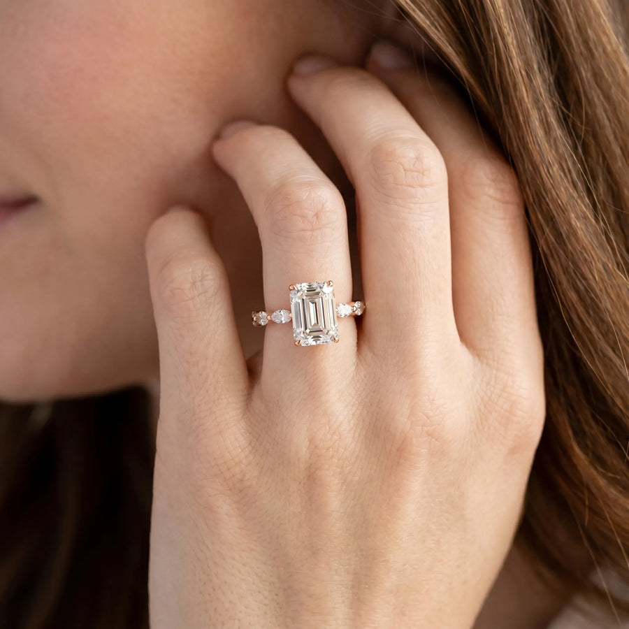 Rose gold Emerald Cut Diamond Ring with Marquise Side Stones and Prong Setting