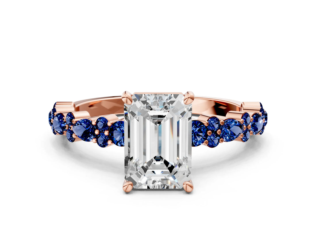 Rose gold Emerald Cut Diamond Side Stone Solitaire Ring with Round with Blue Sapphire side stone and Four-Prong Setting