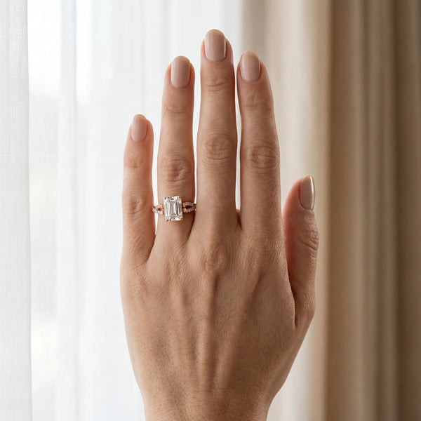 Rose gold Emerald Cut Diamond Solitaire Engagement Ring with Twisted Pavé Band and Four-Prong Setting