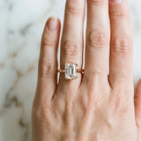 Rose gold Emerald Cut Diamond Solitaire Ring with Flower Prong Setting and Classic Band