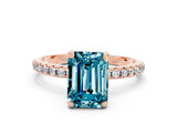 Rose gold Emerald Cut Diamond Solitaire Ring with Four-Prong Setting and Pavé Band