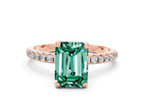 Rose gold Emerald Cut Diamond Solitaire Ring with Four-Prong Setting and Pavé Band