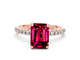 Rose gold Emerald Cut Diamond Solitaire Ring with Four-Prong Setting and Pavé Band