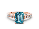 Rose gold Emerald Cut Diamond Solitaire Ring with Pavé Band and Prong Setting