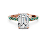 Rose gold Emerald Cut Diamond Solitaire Ring with Round with Green Sapphire side stone Pavé Band and Prong Setting
