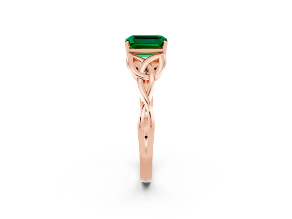 Rose gold Emerald Cut Emerald Solitaire Engagement Ring with Celtic Knot Band and Four-Prong Setting