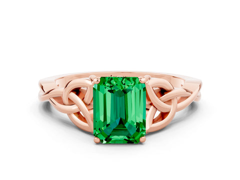 Rose gold Emerald Cut Emerald Solitaire Engagement Ring with Celtic Knot Band and Four-Prong Setting