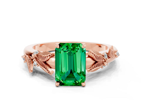 Rose gold Emerald Cut Emerald Solitaire Ring with Leaf Motif Band and Four-Prong Setting