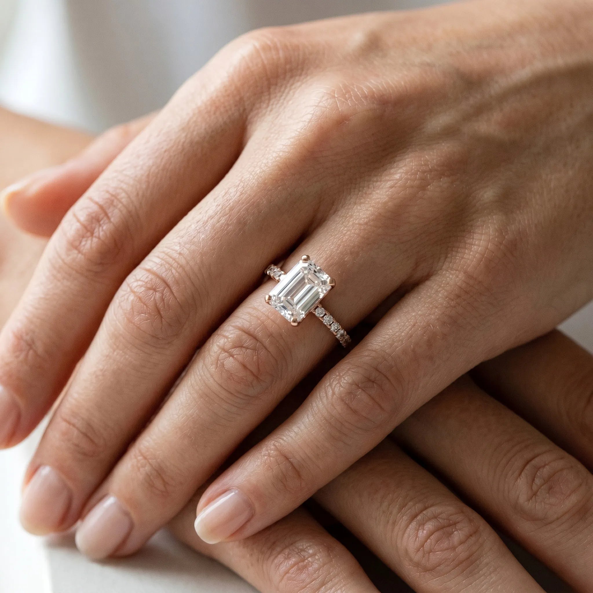Rose gold Emerald Cut Emerald Solitaire Ring with Pavé Band and Four-Prong Setting_36