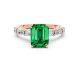 Rose gold Emerald Cut Emerald Solitaire with Side Baguettes and Channel Set Band