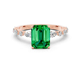 Rose gold Emerald Cut Emerald Solitaire with Side Stones on a Pavé Band and Four-Prong Setting