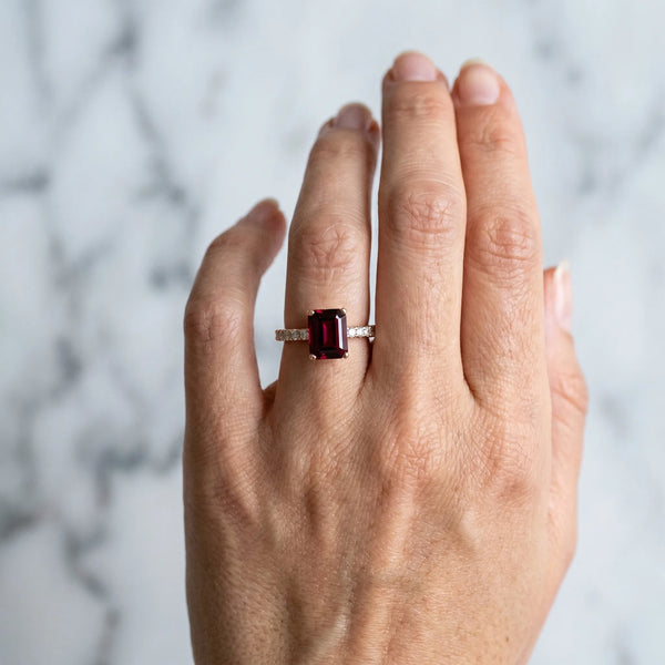 Rose gold Emerald Cut Garnet Solitaire Ring with Round  Pavé Band and Four-Prong Setting