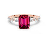 Rose gold Emerald Cut Garnet Solitaire with Side Stones on a Pavé Band and Four-Prong Setting