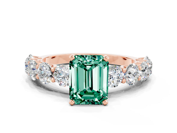 Rose gold Emerald Cut Green Sapphire Prong Setting with Side Stones on a Pave Band