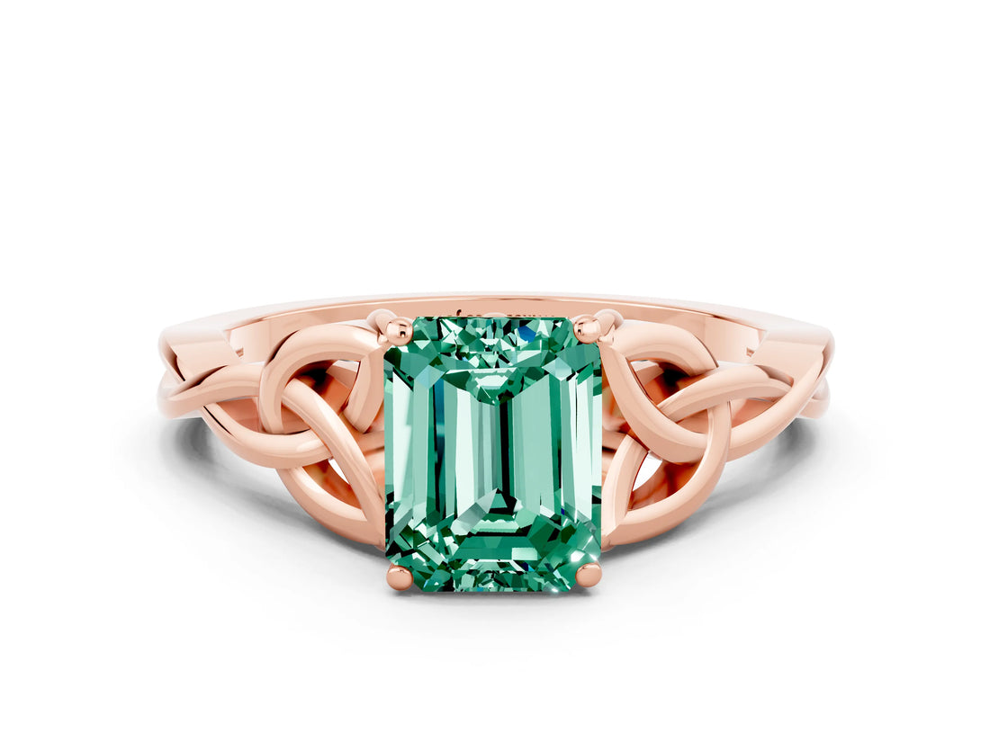 Rose gold Emerald Cut Green Sapphire Solitaire Engagement Ring with Celtic Knot Band and Four-Prong Setting