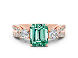 Rose gold Emerald Cut Green Sapphire Three-Stone Ring with Pavé Split Shank and Four-Prong Setting