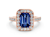 Rose gold Emerald Cut Halo Diamond Ring with Pavé Band and Three-Prong Setting