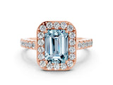 Rose gold Emerald Cut Halo Diamond Ring with Pavé Band and Three-Prong Setting